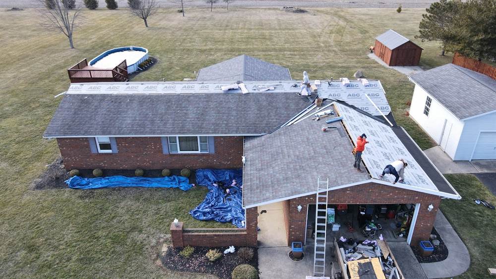 Our licensed crew mid tear-off on a brick ranch, underlayment down