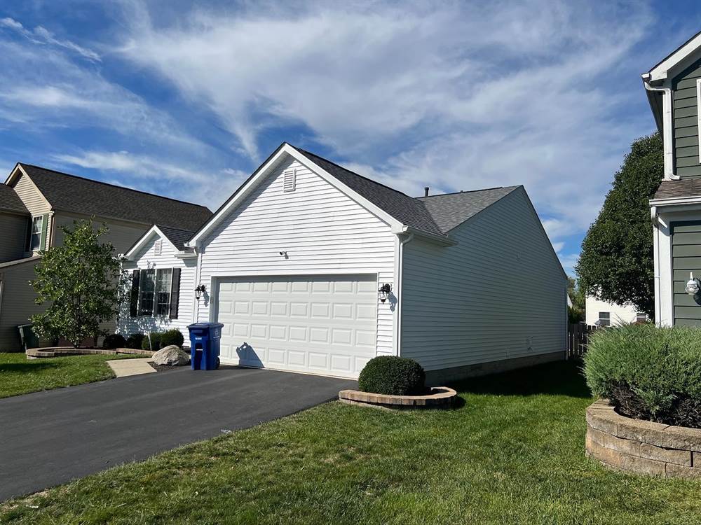 Completed roof with new shingles, vents, and flashing installed