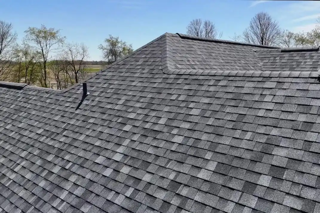 Architectural asphalt shingle courses laid in straight lines across a residential roof