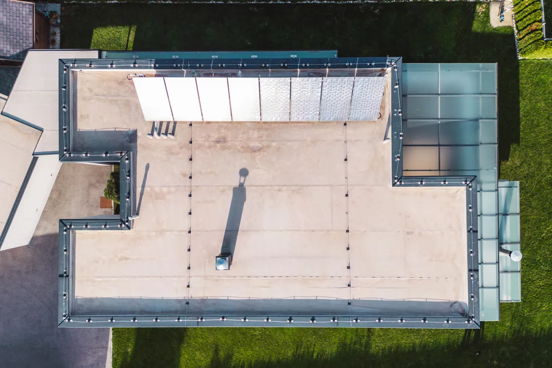 Overhead view of a flat low slope commercial roof and its penetrations in Central Ohio